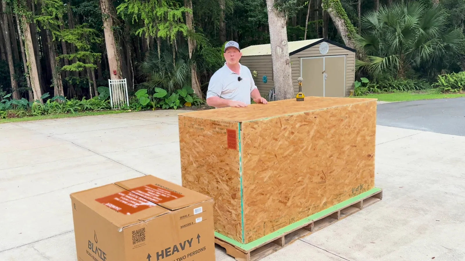 A Fire Islands kitchen in its wood shipping crate next to the boxed Blaze grill